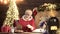 Portrait of Santa Claus reading wish list against home Christmas tree.