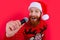 Portrait of Santa Claus singing New Year songs. Enjoying New Year Eve karaoke party