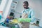 Portrait of satisfied aged person hands hold washing dished kitchen room indoors