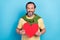 Portrait of satisfied glad person hold large heart symbol postcard look camera isolated on blue color background