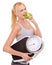 Portrait, scale and woman with apple for progress, diet benefits or food to lose weight in studio. Healthy eating