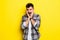 Portrait of scared man in panic nervous excited keeps palm on face, feals fear, isolated on yellow background. Guy shocked by