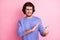 Portrait of scared stresses guy cover telephone wear purple sweater isolated on pastel pink color background