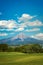 Portrait scenic view of Colima volcano in a sunny day with blue sky