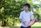 Portrait of school boy have fun with flying disc in the park, Sport and recreation  for children concept