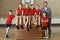 Portrait Of School Gym Team Sitting On Vaulting Horse