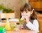 Portrait schoolgirl while having lunch during