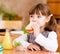 Portrait schoolgirl while having lunch during