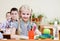 Portrait of schoolkids looking at camera at workplace