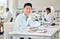 Portrait, science and microscope with an asian man doctor working in a lab for research or innovation. Healthcare