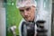 Portrait of a scientist, apothecary extracting cannabis oil in laboratory.