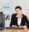 Portrait of a secretary typing on her keybord