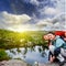 Portrait, selfi, happy couple hipster young girl and man with a beard in the mountains of Norway, in bright sportswear at sunset