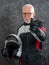 Portrait of senior biker with white helmet make OK