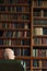 Portrait of senior businessman sitting in library