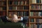 Portrait of senior businessman sitting in library