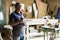 Portrait of senior carpenter. Standing in his workshop.