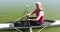 Portrait of senior caucasian woman preparing rowing boat in a river