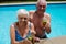 Portrait of senior couple holding glasses of iced tea