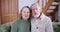 a portrait senior couple husband and wife look into the camera and say hello on the video call. communicate with