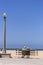 Portrait, Senior couple sitting on boardwalk bench, Santa Monica, CA, USA