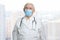 Portrait of senior doctor wearing medical protective mask.