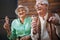 Portrait of senior friends in the city, eating ice cream on a hot summer day.