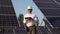 Portrait Of Senior Inspector Engineer With Digital Tablet in Solar Panels Power Farm