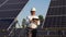 Portrait Of Senior Inspector Engineer With Digital Tablet in Solar Panels Power Farm