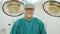 Portrait of senior male surgeon in operating theater.