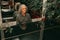 Portrait of senior man, age 60 - 65 years old, gray curly hair, sitting at piano and playing piece of music, focused, injoing