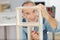 Portrait senior man assembling kitchen furniture