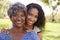 Portrait Of Senior Mother With Adult Daughter In Park