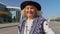 Portrait of senior pensioner tourist grandmother stay near airport hall waiting for plane, travel