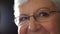 Portrait of a senior woman staring with hope for humanity. Closeup of a grandma with reading glasses for vision