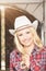 Portrait of Sensual Smiling Happy Blond Cowgirl wearing Stetson