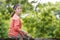 Portrait of serene mature woman in garden