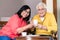 Portrait of serene senior couple enjoying a cup of coffee at hom