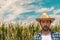 Portrait of serious agronomist in corn maize field