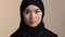 Portrait serious asian korean malaysian girl in black hijab traditional headscarf lonely muslim woman alone islamic