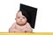 Portrait of a serious baby in an academic hat at the table. Educational concept. Isolate