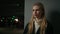 Portrait serious Caucasian 30s woman businesswoman driver car owner posing on darkness background female entrepreneur