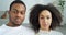 Portrait serious ethnic couple afro young family american curly girl and black guy wearing casual white clothes at home