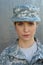 Portrait of serious female airman against dark background