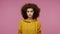 Portrait of serious girl afro hairstyle in hoodie standing calm emotionless, looking at camera with attentive expression