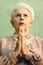 Portrait of serious old caucasian woman praying god