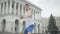 Portrait of serious professional male dancer performing modern dance in city center. Camera zooms out as young confident