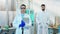 Portrait of serious woman and man pharmacist in the biotechnology laboratory they posing in front of the camera and