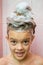 Portrait of seven-year girl with soapy hair