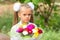 Portrait of a seven-year schoolgirl with big bouquet in hands